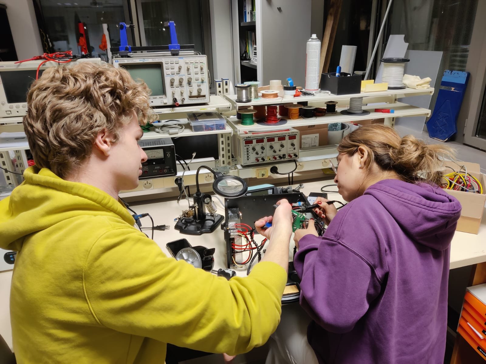Students working on avionics electronics